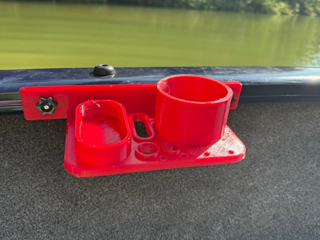 Red rail-mount drink and utility tray on kayak rail