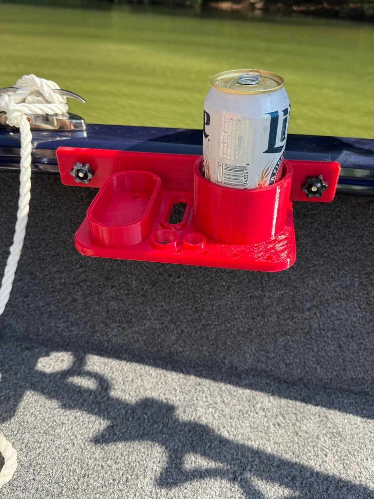 Red utility tray with drink holder mounted on boat