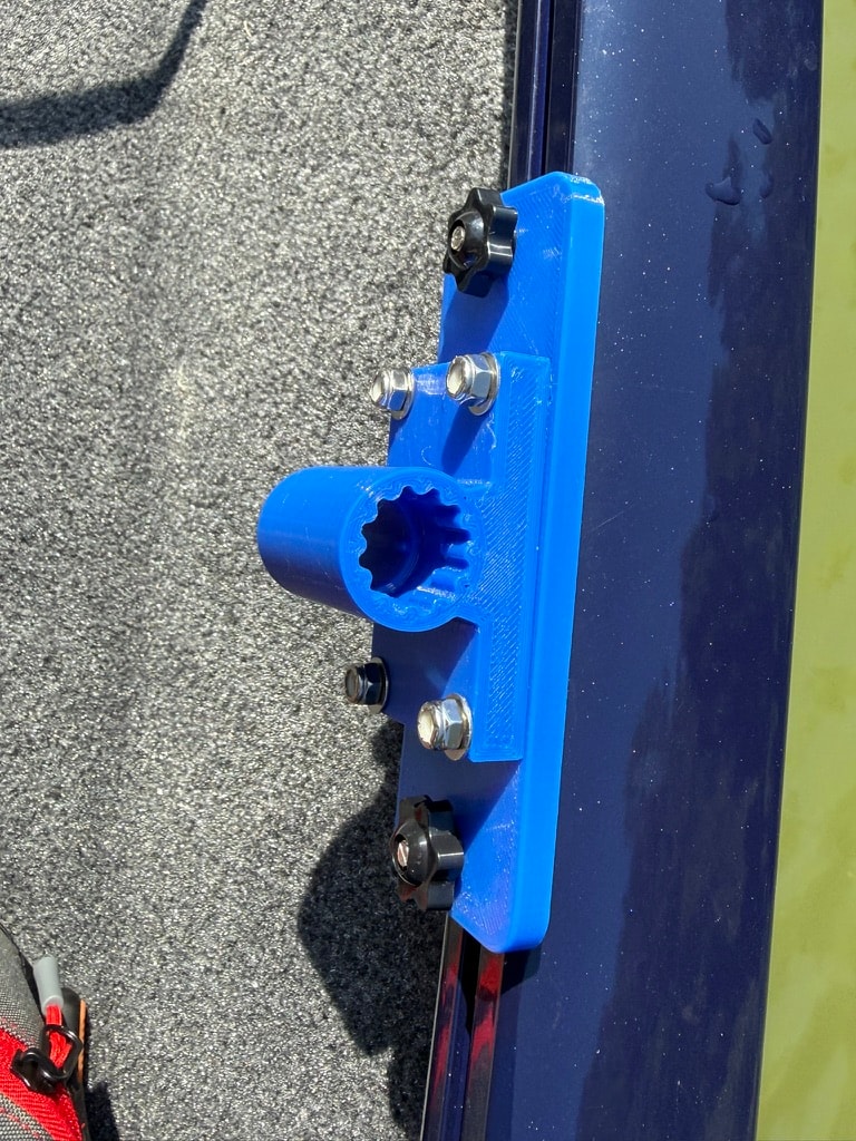 Blue rail-mount rod holder bracket on boat rail