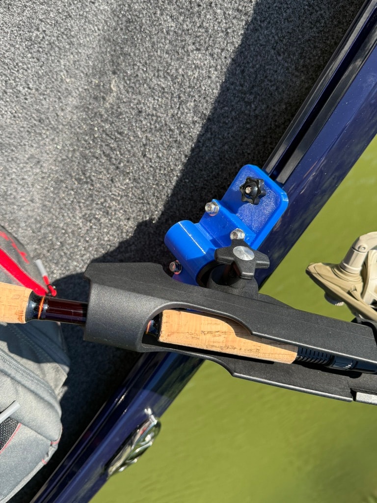 Rail-mount rod holder with fishing rod and reel installed